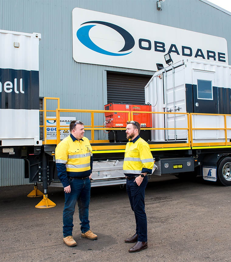 Brendan, director at CoBright, speaking to client while standing in front of Obadare Group workshop.