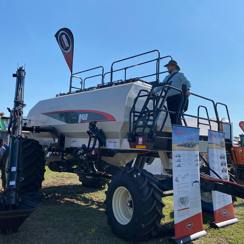 Brendan stands on top of Bourgault's 8450 Air Cart