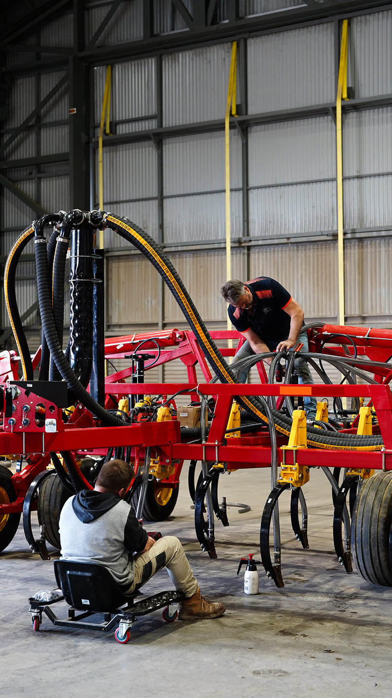 Bourgault staff working in a the workshop on a Bourgault air drill