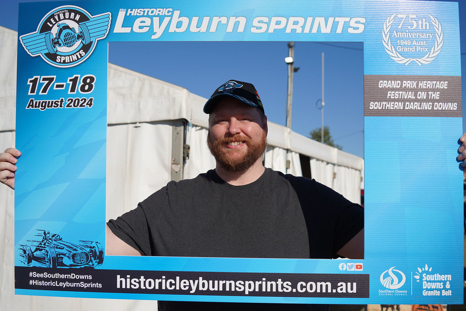 Nate holding up a Leyburn Sprints photo frame around his face