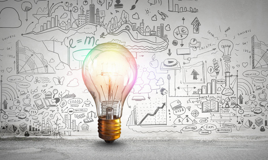 Lightbulb in front of a wall of line illustrations