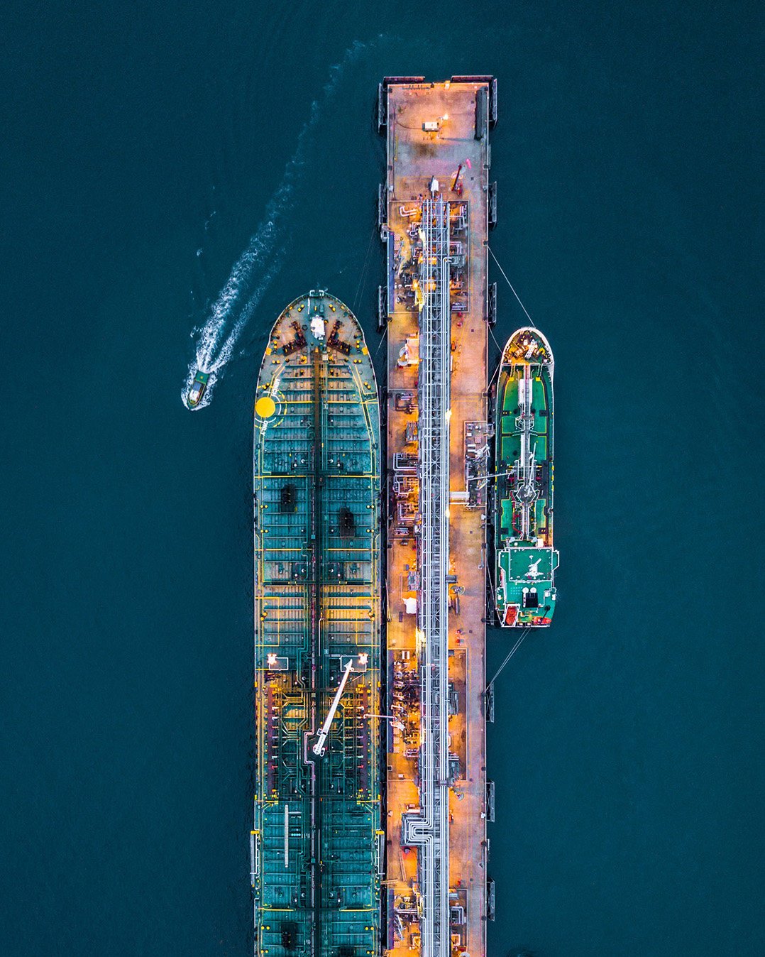 Aerial view of a large cargo ship at a loading dock